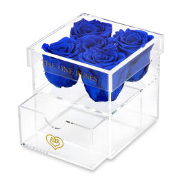 Blue roses in a clear acrylic box with a drawer