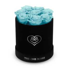 Blue roses arranged in a black round box