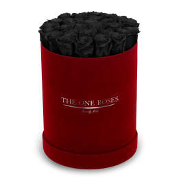 Black roses in a red cylindrical box