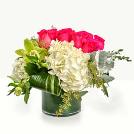 Pink roses and white hydrangeas in a glass vase