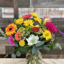 Colorful mixed bouquet in a clear glass vase