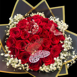 Bouquet of red roses with white baby's breath and butterfly decorations