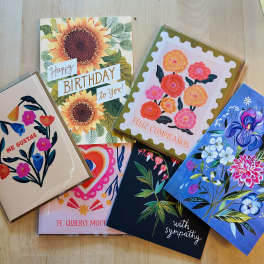 Assorted floral greeting cards with birthday and sympathy messages