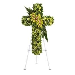 Green floral cross on a metal easel