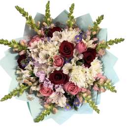 Bouquet of pink and burgundy roses with white daisies and purple accents