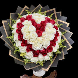 Heart-shaped bouquet of red and white roses in black wrapping