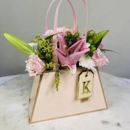 Pink floral gift bag with lilies and roses