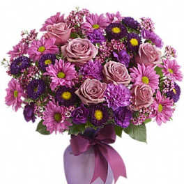 Pink and purple bouquet of roses and daisies in a lavender vase