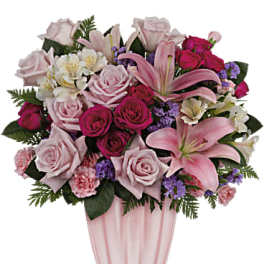 Pink and white mixed flower bouquet in a clear vase