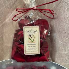 Bag of red rose petals tied with a ribbon