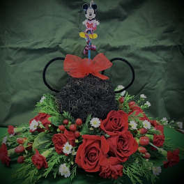Mickey Mouse-themed floral arrangement with red roses and daisies