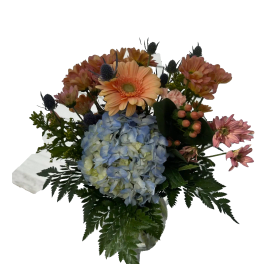 Bouquet with blue hydrangea, peach gerbera daisies, and pink flowers