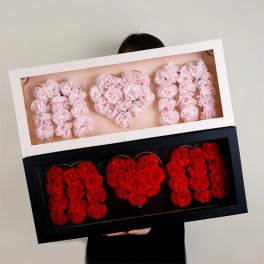 Heart-shaped floral boxes with pink and red flowers