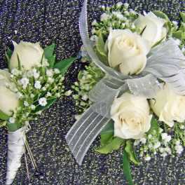 White rose boutonniere and matching wrist corsage with silver ribbon