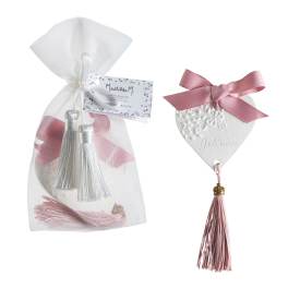 Decorative white sachet with pink ribbon and tassel, plus a matching heart ornament