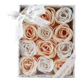 Box of cream and peach rose-shaped flowers with a ribbon bow