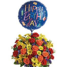 Birthday balloon above a colorful flower arrangement in a blue vase