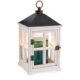 White wooden lantern with a glass candle holder inside