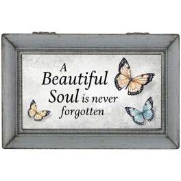 Framed memorial sign with butterflies and the words "A Beautiful Soul is never forgotten"