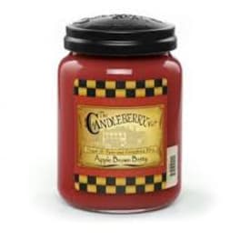 Red candle jar with a black lid and label