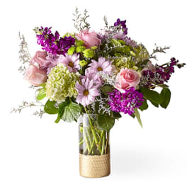 Bouquet of pink and purple flowers in a glass vase