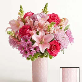 Pink and lavender bouquet in a tall pink vase