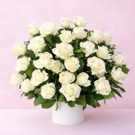White rose bouquet in a white vase