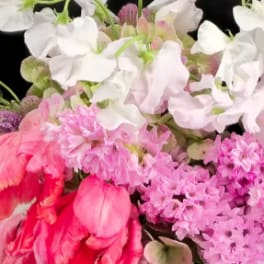 Pink and white sweet pea bouquet with ruffled blooms