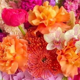 Bright mixed bouquet with orange, pink, and purple flowers