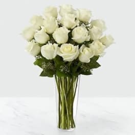 Bouquet of white roses in a clear glass vase