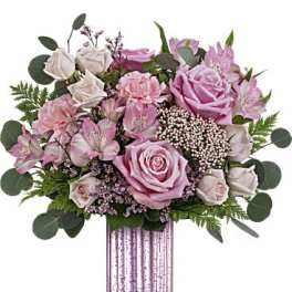 Pink roses and alstroemeria in a striped vase