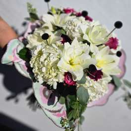 Bouquet of white lilies and pink roses with pale hydrangea