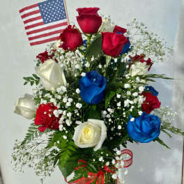 Bouquet of red, white, and blue roses with a small American flag