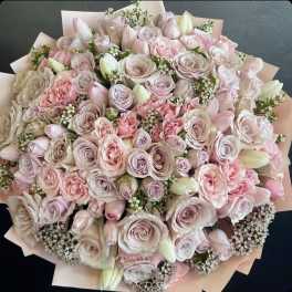 Large bouquet of pale pink and cream roses with white buds