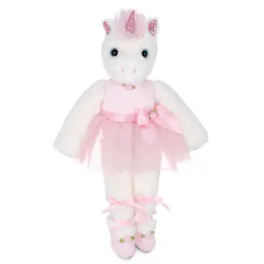 Stuffed white unicorn doll wearing a pink dress and matching shoes.