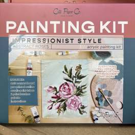 Painting kit box with abstract pink roses and art supplies
