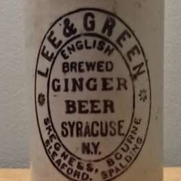 Vintage ceramic bottle labeled brewed ginger beer