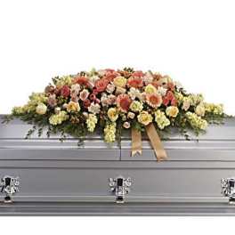 Large floral spray on a silver casket