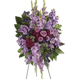 Tall purple floral standing spray on an easel