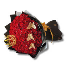 Bouquet of red roses wrapped in black paper with gold butterfly accents