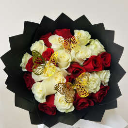 Bouquet of red and white roses with gold butterfly picks