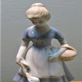 Ceramic figurine of a girl with geese