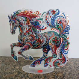 Colorful jeweled horse figurine on a clear stand