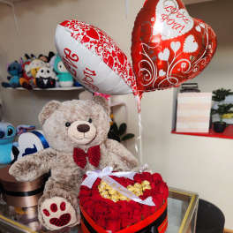 Heart-shaped rose box with teddy bear and Valentine balloons