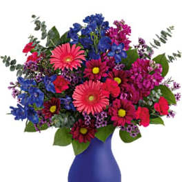 Colorful mixed bouquet in a blue vase
