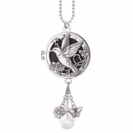 Silver hummingbird locket necklace with dangling flower, butterfly, and crystal charms