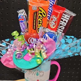 Candy bouquet in a Swig tumbler with colorful ribbons