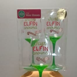 Three green wine glasses in packaging with "Just Elfin around" text