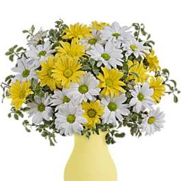 Yellow and white daisy bouquet in a yellow vase