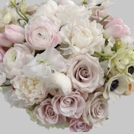 Bouquet of pale pink and white roses with white blooms